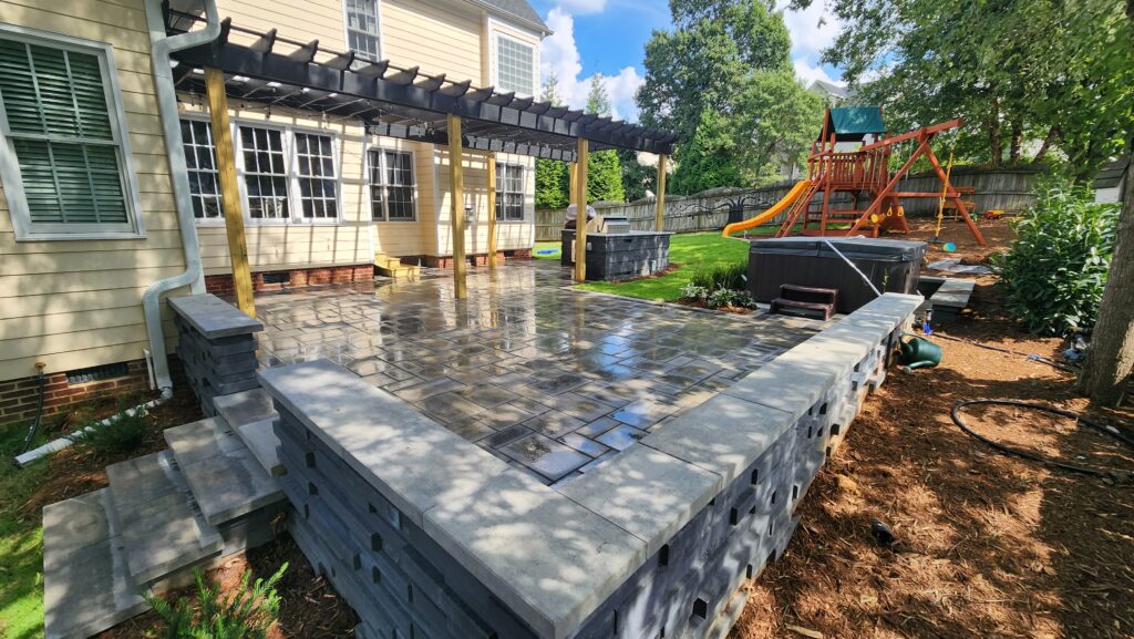 Stone Patio with outdoor kitchen and pergola