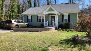 stone paver wall surrounding concrete ramp