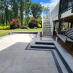 stone patio with dark gray accent border