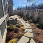 drainage improved through grading and permeable paver walkway