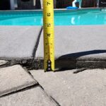 Pavers sinking around the coping