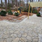 Newly constructed pergola over a flagstone patio/walkway