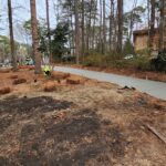 Newly poured long concrete driveway.