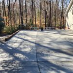 New concrete driveway leading to garage