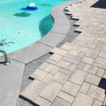 Rebuilding stone patio around curved gray coping